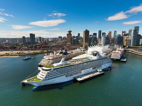 Cruise ships are seen docked in Vancouver in a file photo from July 3, 2016. Passenger ships sailing from the United States to Alaska will no longer be legally required to stop in B.C. en route.