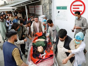 An injured woman is transported  to a hospital after a blast in Kabul, Afghanistan on May 8