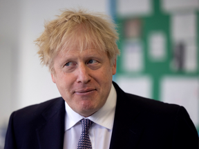 Britain's Prime Minister Boris Johnson, answers questions from the media after taking part in a science lesson at King Solomon Academy in London, on April 29, 2021.