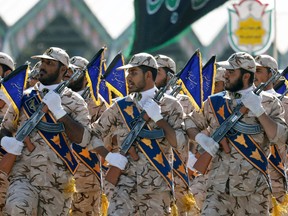 Iranian soldiers march during the annual military parade marking the anniversary of the outbreak of its devastating 1980-1988 war with Saddam Hussein's Iraq, on September 22,2017 in Tehran