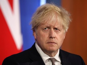 Britain's Prime Minister Boris Johnson attends a virtual news conference to announce changes to lockdown rules in England at Downing Street, in London, on May 10, 2021.