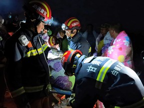Rescue workers work at the site where extreme cold killed participants in an 100-km ultramarathon race in Baiyin, China on May 22, 2021.