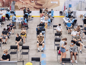 People at the Bill Durnan Arena COVID-19 vaccination site in Montreal, Saturday, May 22, 2021.