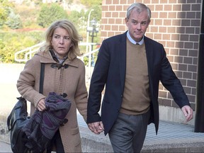 Dennis Oland and his wife Lisa arrive at Harbour Station arena in Saint John, N.B., Oct. 2018 for jury selection in the retrial in the bludgeoning death of his millionaire father, Richard Oland.