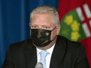 Ontario Premier Doug Ford listens to a question during a press conference on the province's COVID-19 reopening plan on Thursday, May 13,