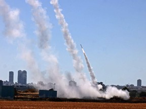 Israel's Iron Dome aerial defence system is activated to intercept a rocket launched from the Gaza Strip, controlled by the Palestinian Hamas movement, above the southern Israeli city of Ashdod, on May 12, 2021.