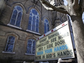 A sign promoting hand washing stands outside a closed church during the global outbreak of coronavirus disease in Toronto