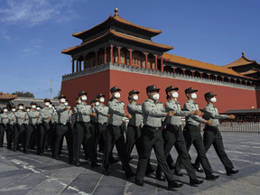 People’s Liberation Army soldiers march outside the Forbidden City, near Tiananmen Square. Canada has increased participation in joint military exercises with allies in the region, including two anti-submarine warfare exercises.