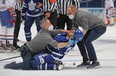 Maple Leafs captain John Tavares is tended to be medical staff after being injured against the Montreal Canadiens in Game 1 at Scotiabank Arena in Toronto on May 20, 2021 in Toronto.
