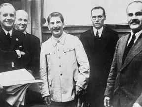 From left to right: Nazi German Foreign Minister Joachim Von Ribbentrop, German Under State Secretary Friedrich Gaus, Soviet leader Joseph Stalin and his Foreign Minister Vyacheslav Molotov. Photo taken after the signing of the 1939 Treaty of Non-aggression between Germany and the Union of Soviet Socialist Republics.