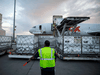 Workers unload a shipment of the Moderna COVID-19 vaccine at the FedEx hub at Pearson International Airport in Toronto on May 20, 2021.