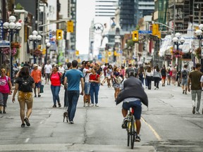 Looking south towards a car-free Yonge Street during Open Streets TO in Toronto, Ont. on Sunday August 18, 2019.