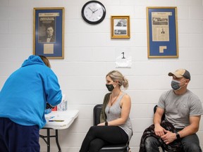 Stefanie Dunahay, 39, and Matt Dunahay, 39, wait to receive their coronavirus disease (COVID-19) vaccine as vaccine eligibility expands to anyone over the age of 16 at the Bradfield Community Center through Health Partners of Western Ohio in Lima, Ohio, U.S., March 29, 2021.