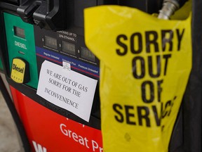 An "out of gas" sign is seen at a gas station in Smyrna, Ga.,  on May 11, 2021, following the cyberattack on the Colonial Pipeline. "Putting aside idiots believing a solar panel can replace fossil fuels, can someone tell me who didn’t realize our energy infrastructure was spectacularly vulnerable," writes John Robson.