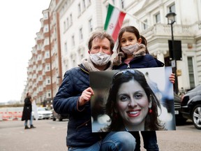 Richard Ratcliffe, husband of British-Iranian aid worker Nazanin Zaghari-Ratcliffe, and their daughter Gabriella protest outside the Iranian Embassy in London, Britain March 8, 2021.