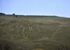 The giant’s full size can’t be easily seen from the ground. People are seen on the hill during the chalk restoration.