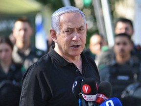 In this file photo Israeli Prime Minister Benjamin Netanyahu speaks during a meeting with Israeli border police in the central city of Lod, near Tel Aviv, on May 13, 2021, a day after Israeli far-right groups clashed with security forces and Arab Israelis.