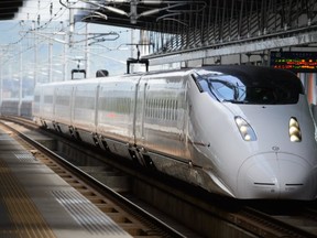 A Kyushu Railway Co. 800 series Shinkansen bullet train arrives at Kurume Station in Kurume City, Fukuoka Prefecture, Japan, on Tuesday, Oct. 11, 2016.