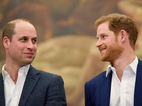 In this file photo taken on April 26, 2018 Britain's Prince Harry (R) and Britain's Prince William, Duke of Cambridge attend the opening of Greenhouse Sports Centre in central London on April 26, 2018, which will provide sport, coaching and social facilities for young people in the surrounding community.