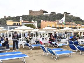 People enjoy a Sunday at the beach as coronavirus disease (COVID-19) restrictions ease around the country, in Castiglione della Pescaia, Italy, May 2, 2021.