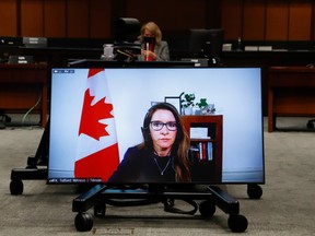 Katie Telford, Chief of Staff to Canada's Prime Minister Justin Trudeau, appears on a screen as she attends a House of Commons defence committee meeting on sexual misconduct in the armed forces, in Ottawa, Ontario, Canada May 7, 2021.