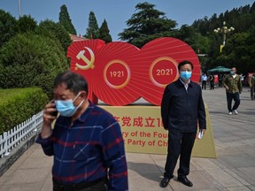 This picture taken during a government organised media tour shows people visiting the Xibaipo Memorial Hall, southwest of the former site of Central Committee of the Chinese Communist Party in Pingshan county, some 70 kms from Shijiazhuang, in Hebei province on May 12, 2021, ahead of the 100th year of the party's founding in July.