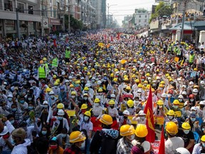 In this file photo taken on February 22, 2021, protesters take part in a demonstration against the military coup in Mandalay.