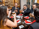 Customers sit with their drinks inside a re-opened London pub as COVID-19 lockdown restrictions ease across the country on May 17, 2021.