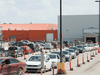 Vehicles line up at a drive-thru COVID-19 vaccine clinic in Regina on May 14, 2021.