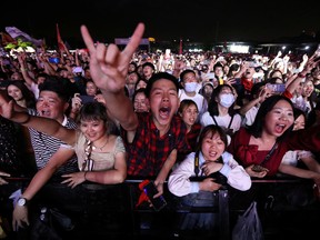 Fans attend a performance of a rock band at the Strawberry Music Festival during Labour Day holiday in Wuhan, Hubei Province, China May 1, 2021.