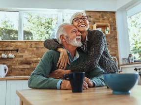 Mature woman hugging her husband