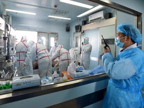 This photo taken on February 12, 2017 shows an H7N9 bird flu patient being treated in a hospital in Wuhan in central China.