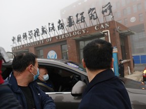 Members of the World Health Organization team investigating the origins of the COVID-19 pandemic arrive at the Wuhan Institute of Virology in Wuhan, China, on Feb. 3.