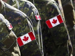In this file photo, members of the Canadian Armed Forces march during the Calgary Stampede parade in Calgary, on Friday, July 8, 2016.