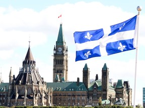 The Quebec flag is seen overlooking Parliament Hill.