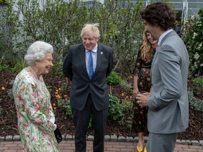 British Prime Minister Boris Johnson, wife Carrie Johnson, Queen Elizabeth II and Canadian Prime Minister Justin Trudeau chat at a drinks reception for Queen Elizabeth II and G7 leaders