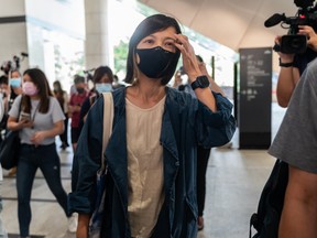 Apple Daily deputy chief editor Chan Pui-man leaves after the court appearance of chief executive Cheung Kim-hung and Apple Daily editor-in-chief Ryan Law at the West Kowloon Magistrates' Courts on June 19.
