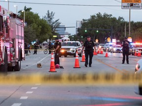 Police investigate the scene where a pickup truck drove into a crowd of people at a Pride parade on June 19, 2021 in Wilton Manors, Florida.