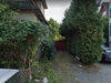 A Google Street View image of 1912 William St., a Vancouver property listed in May for $249,000. The property, which is a 9 foot x 60 foot microlot, consists of the gravel driveway with the shed at the back.