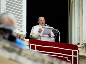 Pope Francis speaks from the window of the apostolic palace overlooking St. Peter's square in the Vatican during the weekly Angelus prayer on June 6, 2021.