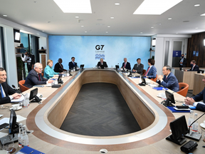 (From centre clockwise) British Prime Minister Boris Johnson, U.S. President Joe Biden, France's President Emmanuel Macron, Canada's Prime Minister Justin Trudeau, Japan's Prime Minister Yoshihide Suga, President of the European Council Charles Michel, Italy's Prime minister Mario Draghi, Australia's Prime Minister Scott Morrison, Germany's Chancellor Angela Merkel, South Africa's President Cyril Ramaphosa and South Korea's President Moon Jae-in attend a working session at the G7 summit in Carbis Bay, Cornwall on June 12, 2021.