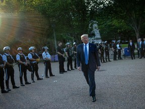 U.S. President Donald Trump leaves the White House on foot to go to St John's Episcopal church across Lafayette Park in Washington, DC.