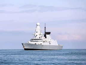 This handout photo taken on June 26, 2021, and released by the British Embassy in Georgia, shows the British Royal Navy destroyer HMS Defender as it arrives in the Black Sea port of Batumi.