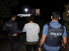 A person is detained by Australian Federal Police during Operation Ironside.