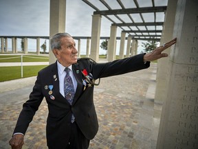 American veteran Charles Shay, 96, touches a name engraved into the British Normandy Memorial during its official opening on the 77th anniversary of D-Day on June 06, 2021 in Ver-sur-Mer Normandy, France.