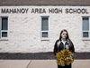 Brandi Levy in front of the Mahanoy High school in Mahanoy, Pennsylvania.