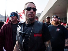 Far-right and ultra-nationalist groups, including the Northern Guard, Proud Boys, and individuals wearing Soldiers of Odin patches at Nathan Philips Square in 2017.