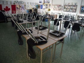 A classroom sits empty at the Eric Hamber Secondary School in Vancouver on March 23, 2020. The Vancouver School Board is eliminating honours programs for math and science, and has already ended honours English, claiming the honours programs create inequities among students.