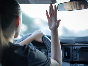 Angry woman driver. Rushing to work. Traffic jam. Busy life. Teenager reckless driving.