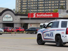 London police on Monday cordoned off a section of the parking lot in Cherryhill Mall, where a man, 20, was arrested following a crash in the city’s northwest end that left four people dead Sunday night. (DALE CARRUTHERS, The London Free Press)
